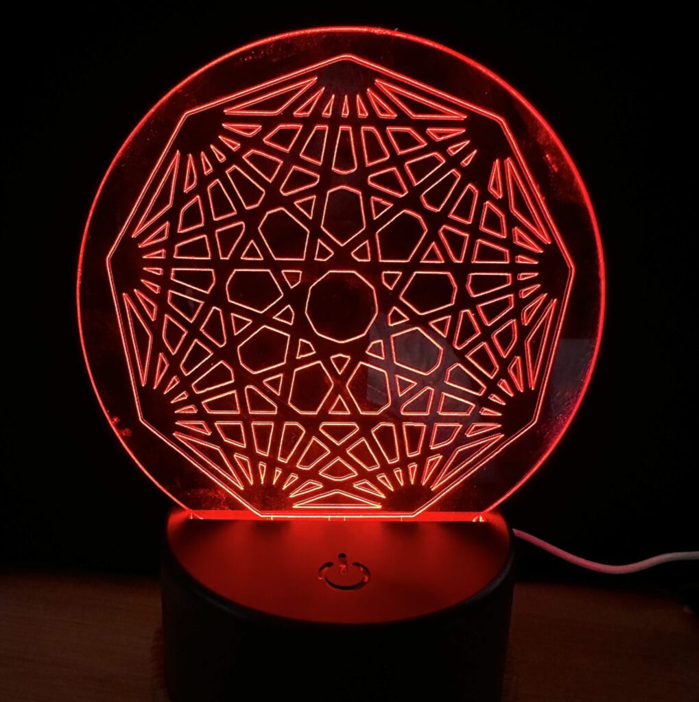 Nonagon Mini LED Desk Sign that is battery and USB powered with remote for color change.